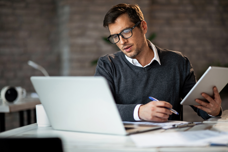 A man researches how to get certified in ABA therapy.